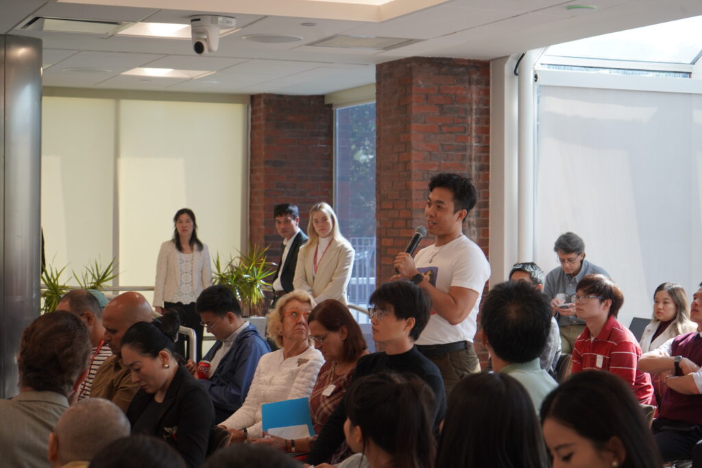 A guest asking a question to the panelist. 